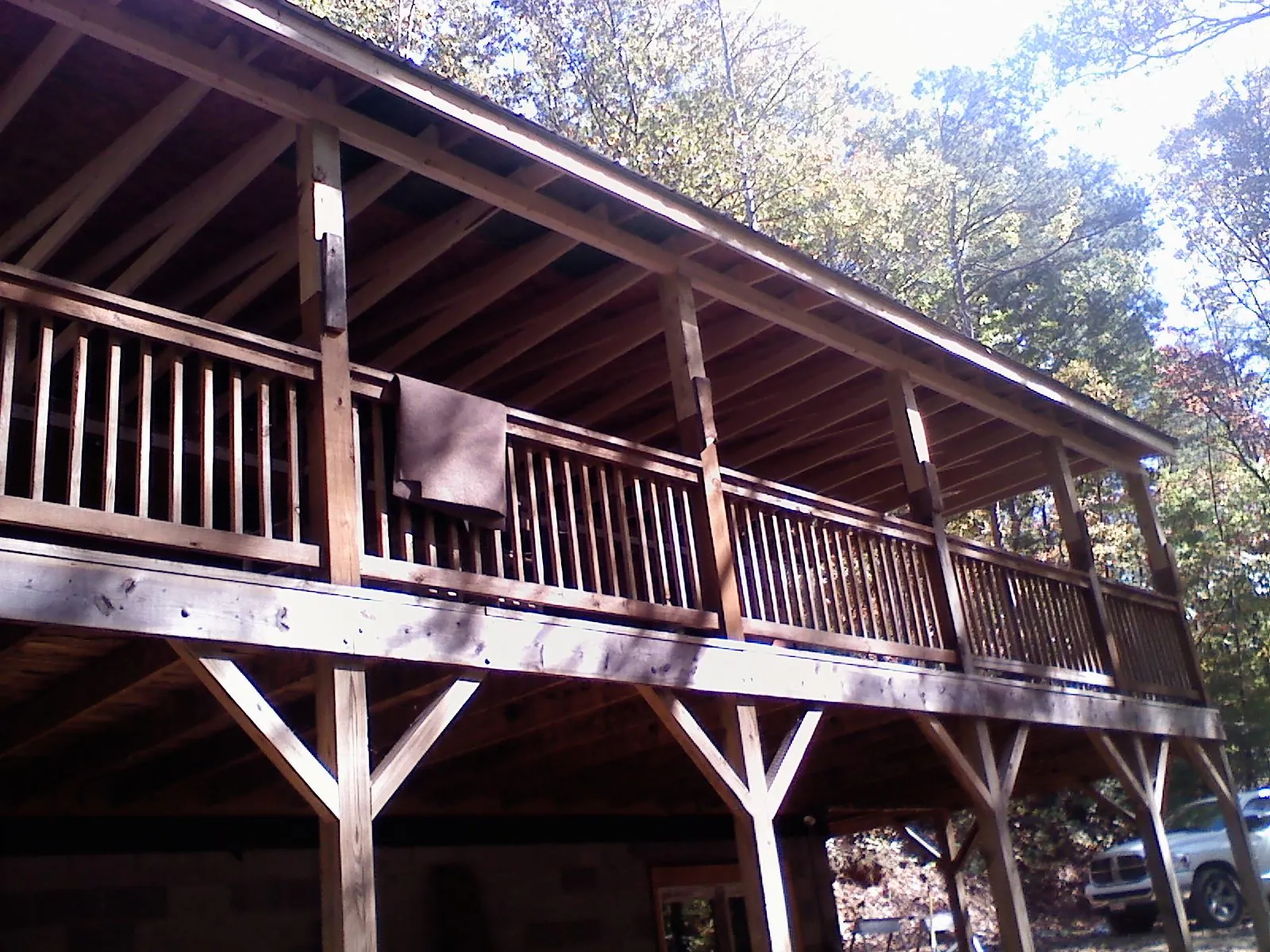 Timber framing under a new elevated porch and deck — Roof Leak Repair in Justice by Roofing Brothers